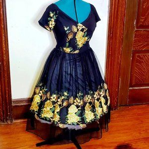Black pinup dress with yellow roses